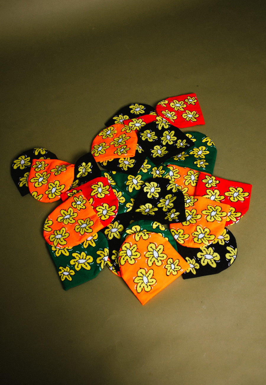 Not A Bad Life's Flower Beanies in red, orange, black, and greem